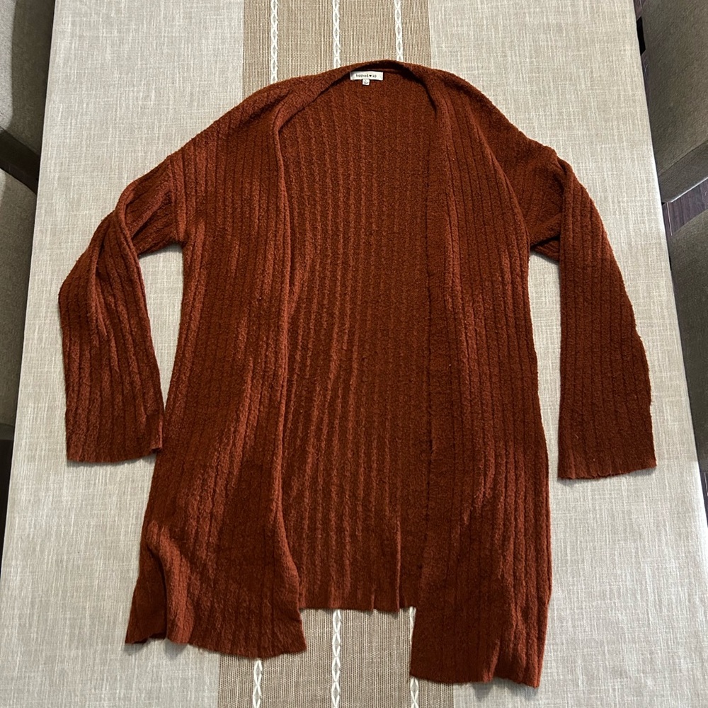 A long warm orange sweater